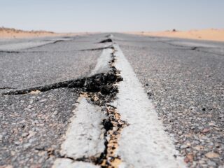 a crack in the middle of a road in the middle of nowhere