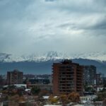 a city with mountains in the background